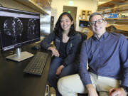 Drs. Erin Yamamoto, left, and Juan Piantino used special imaging to spot a long-suspected pathway the human brain uses to clear waste at Oregon Health &amp; Science University in Portland.