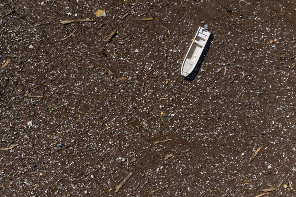 FILE - A boat is stuck near a dam on the Neretva River in Grabovica, Bosnia, Oct. 13, 2024.