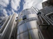 FILE - A liquid carbon dioxide containment unit stands outside the fabrication building of Glenwood Mason Supply Company, April 18, 2023, in the Brooklyn borough of New York.