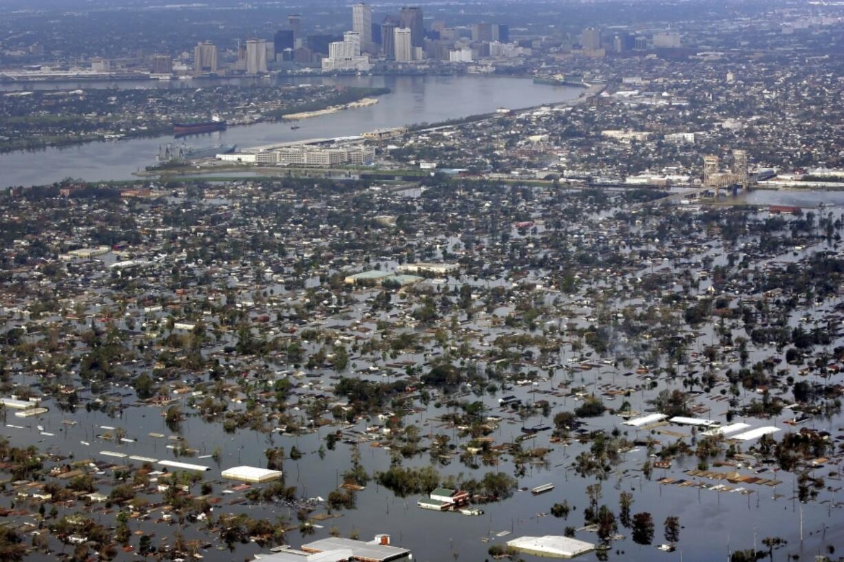 FILE - Floodwaters from Hurricane Katrina cover a portion of New Orleans on Aug. 30, 2005. (AP Photo/David J.