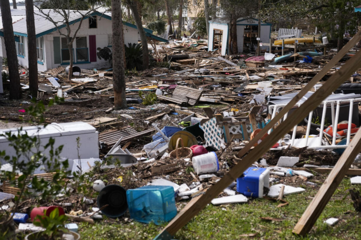 FILE - Destruction to the Faraway Inn Cottages and Motel is visible in the aftermath of Hurricane Helene, in Cedar Key, Fla., Sept. 27, 2024.