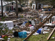 FILE - Destruction to the Faraway Inn Cottages and Motel is visible in the aftermath of Hurricane Helene, in Cedar Key, Fla., Sept. 27, 2024.