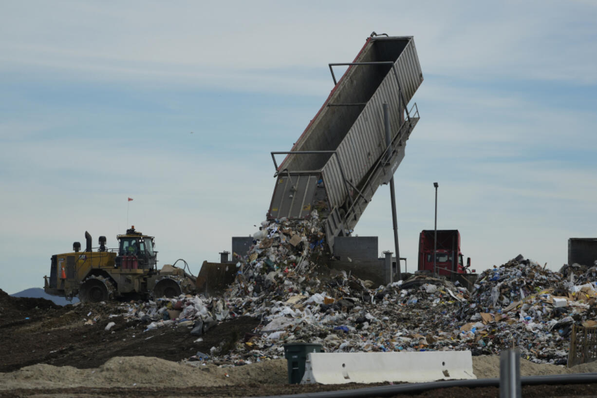 Trash is unloaded Jan. 26 at the Otay Landfill in Chula Vista, Calif.