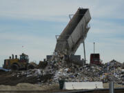 Trash is unloaded Jan. 26 at the Otay Landfill in Chula Vista, Calif.