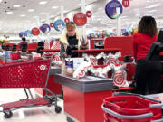 A shopper checks out at a cash register in a grocery store in Glenview, Ill., Sunday, Oct. 27, 2024. (AP Photo/Nam Y.