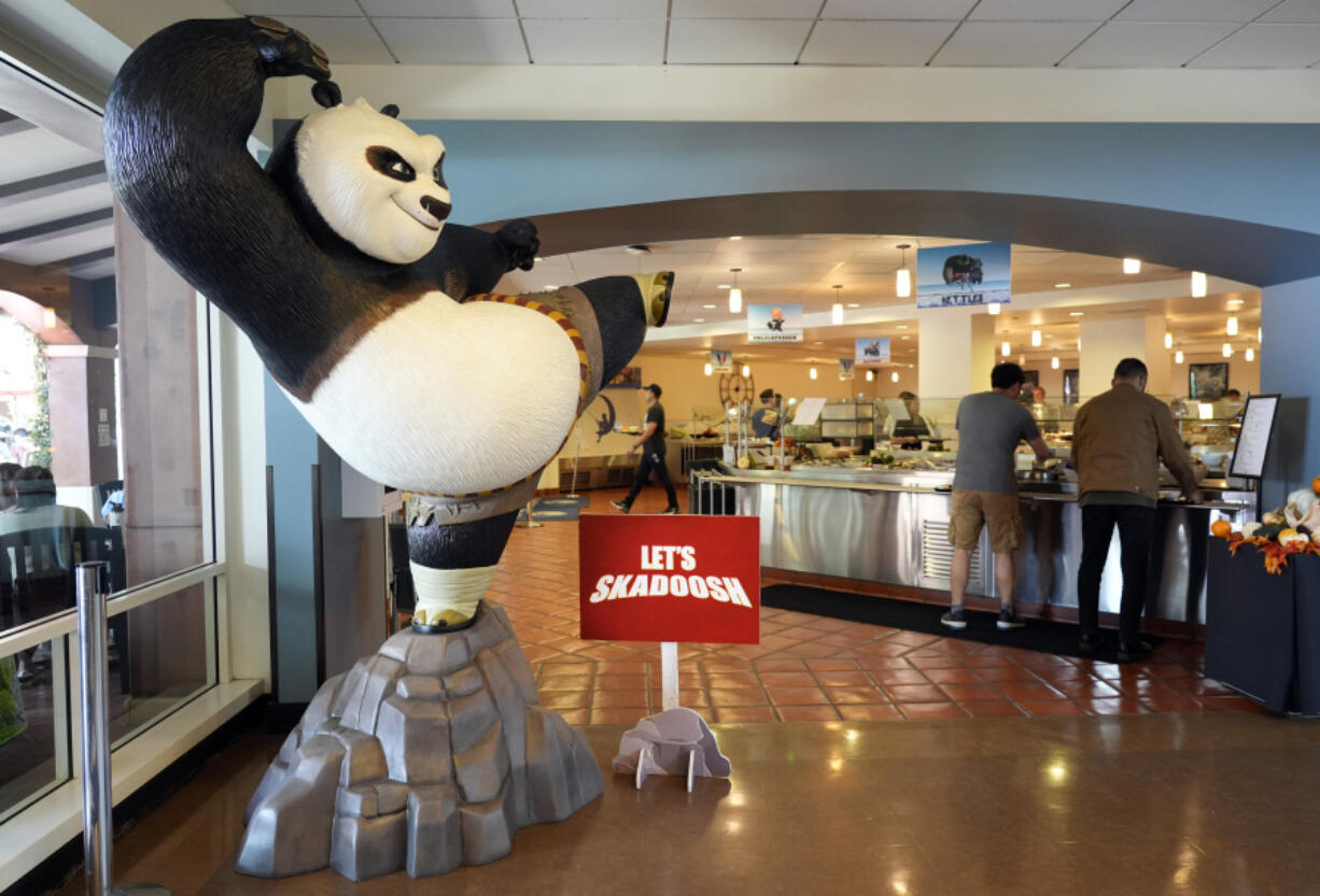 A statue of the DreamWorks Animation character Po, from the &ldquo;Kung Fu Panda&rdquo; films, stands near employees inside the DreamWorks commissary Sept. 25 in Glendale, Calif.