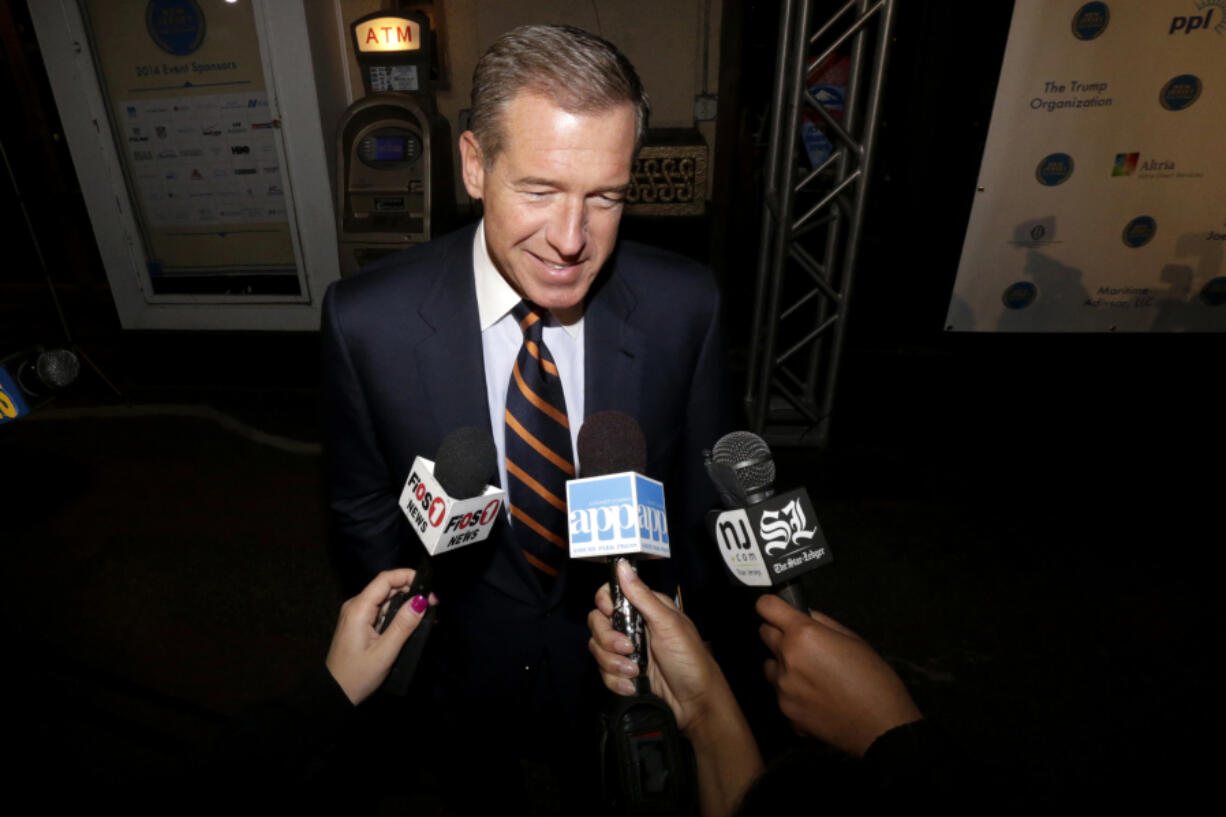 FILE - Television journalist Brian Williams arrives at the Asbury Park Convention Hall during red carpet arrivals prior to the New Jersey Hall of Fame inductions, in Asbury Park, N.J., Nov. 13, 2014.