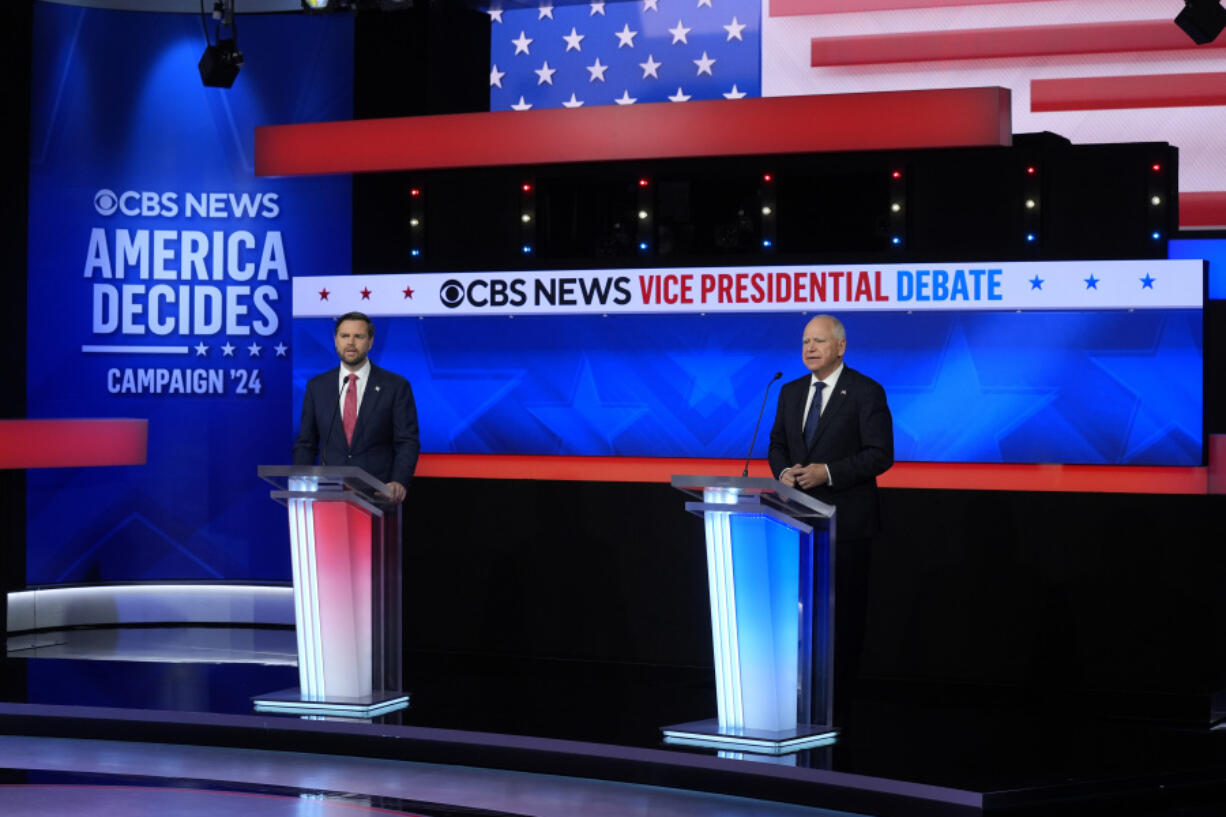 Republican vice presidential nominee Sen. JD Vance, R-Ohio, and Democratic vice presidential nominee Minnesota Gov. Tim Walz, participate in a vice presidential debate hosted by CBS News in New York, Tuesday, Oct. 1, 2024.