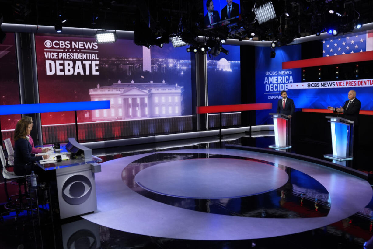 Democratic vice presidential nominee Minnesota Gov. Tim Walz speaks during a vice presidential debate hosted by CBS News, with Republican vice presidential nominee Sen. JD Vance, R-Ohio, Tuesday, Oct. 1, 2024, in New York, as moderators Norah O&rsquo;Donnell and Margaret Brennan listen.