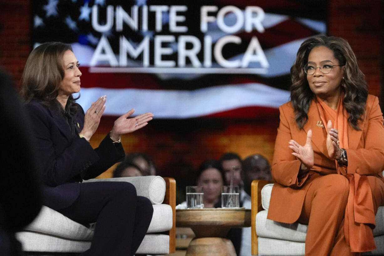 FILE - Democratic presidential nominee Vice President Kamala Harris, left, joins Oprah Winfrey at Oprah&rsquo;s Unite for America Live Streaming event Sept. 19, 2024 in Farmington Hills, Mich.