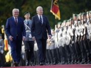 FILE - President Joe Biden and German President Frank-Walter Steinmeier inspect the military honour guard during the welcoming ceremony at Bellevue Palace in Berlin, Germany, on Oct. 18, 2024.