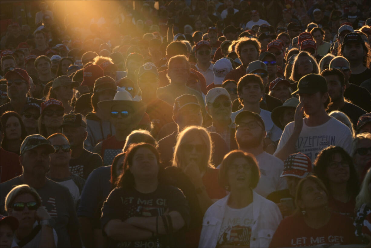 FILE - Supporters listen as Republican presidential nominee former President Donald Trump speaks during a campaign rally at the Butler Farm Show, Saturday, Oct. 5, 2024, in Butler, Pa.