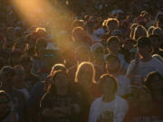 FILE - Supporters listen as Republican presidential nominee former President Donald Trump speaks during a campaign rally at the Butler Farm Show, Saturday, Oct. 5, 2024, in Butler, Pa.