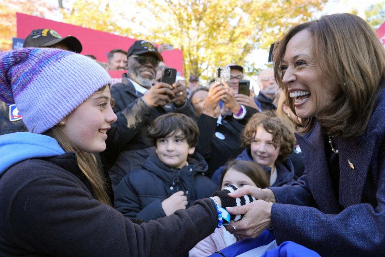 Democratic presidential nominee Vice President Kamala Harris greets people at a campaign event at Washington Crossing Historic Park, Wednesday, Oct. 16, 2024, in Washington Crossing, Pa.