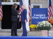 Democratic presidential nominee Vice President Kamala Harris, left, is greeted by former Congresswoman Liz Cheney, R-Wyo., during a campaign event at Ripon College in Ripon, Wis., Thursday, Oct. 3, 2024.