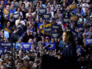 Attendees listen as Democratic presidential nominee Vice President Kamala Harris speaks at a campaign rally at the Resch Expo in Green Bay, Wis., Thursday, Oct. 17, 2024.