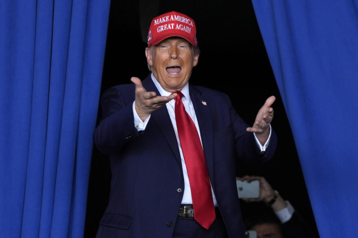 FILE - Republican presidential nominee former President Donald Trump arrives to speak during a campaign rally at Dodge County Airport, Sunday, Oct. 6, 2024, in Juneau, Wis.