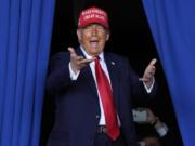 FILE - Republican presidential nominee former President Donald Trump arrives to speak during a campaign rally at Dodge County Airport, Sunday, Oct. 6, 2024, in Juneau, Wis.