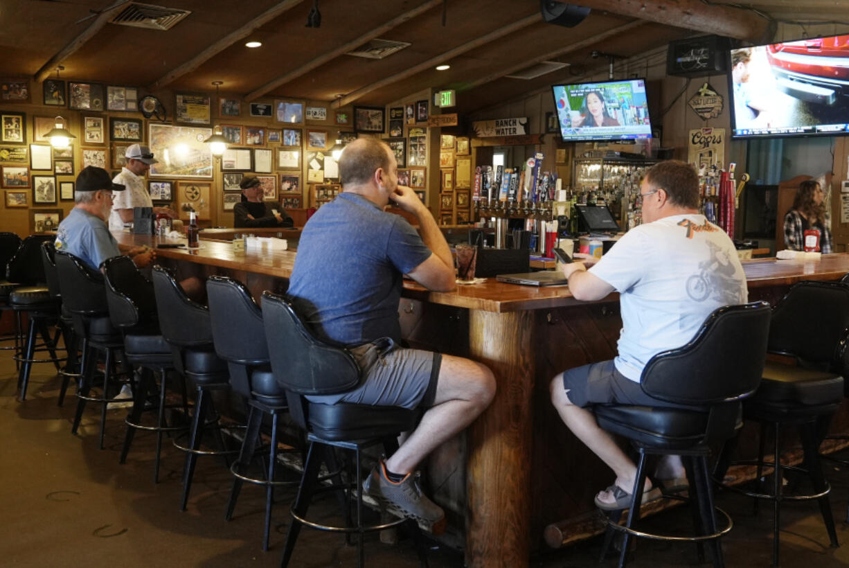 Patrons sit at the bar for lunch at Harold&rsquo;s Cave Creek Corral, regarding Arizona Prop 138 on minimum wage Thursday, Oct. 3, 2024, in Cave Creek, Ariz. (AP Photo/Ross D.