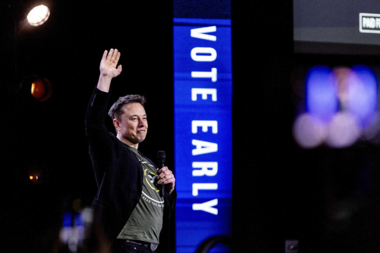 Elon Musk gestures as he speaks at Life Center Church in Harrisburg, Pa., Saturday, Oct. 19, 2024.