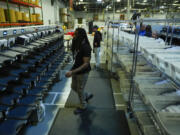 Election workers demonstrates mail-in ballot processing during a media preview at the Philadelphia Election Warehouse, in Philadelphia, Friday, Oct. 25, 2024.