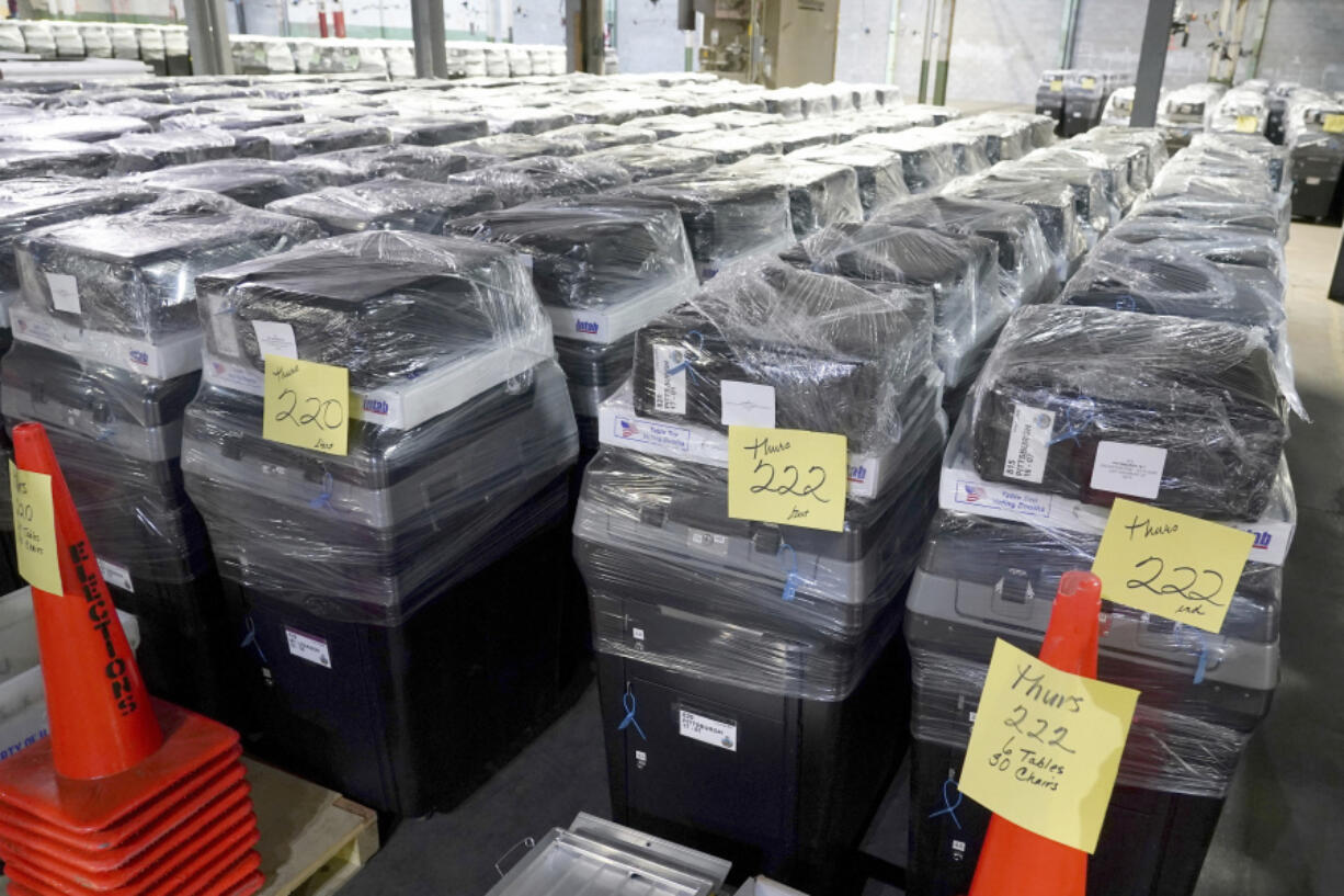 Voting machines are prepared for use on Election Day at the Allegheny County Elections Division warehouse, Wednesday, Oct. 30, 2024, in Pittsburgh.