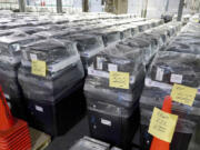 Voting machines are prepared for use on Election Day at the Allegheny County Elections Division warehouse, Wednesday, Oct. 30, 2024, in Pittsburgh.