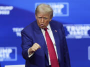 Republican presidential nominee former President Donald Trump gestures at a campaign town hall at the Greater Philadelphia Expo Center &amp; Fairgrounds, Monday, Oct. 14, 2024, in Oaks, Pa.