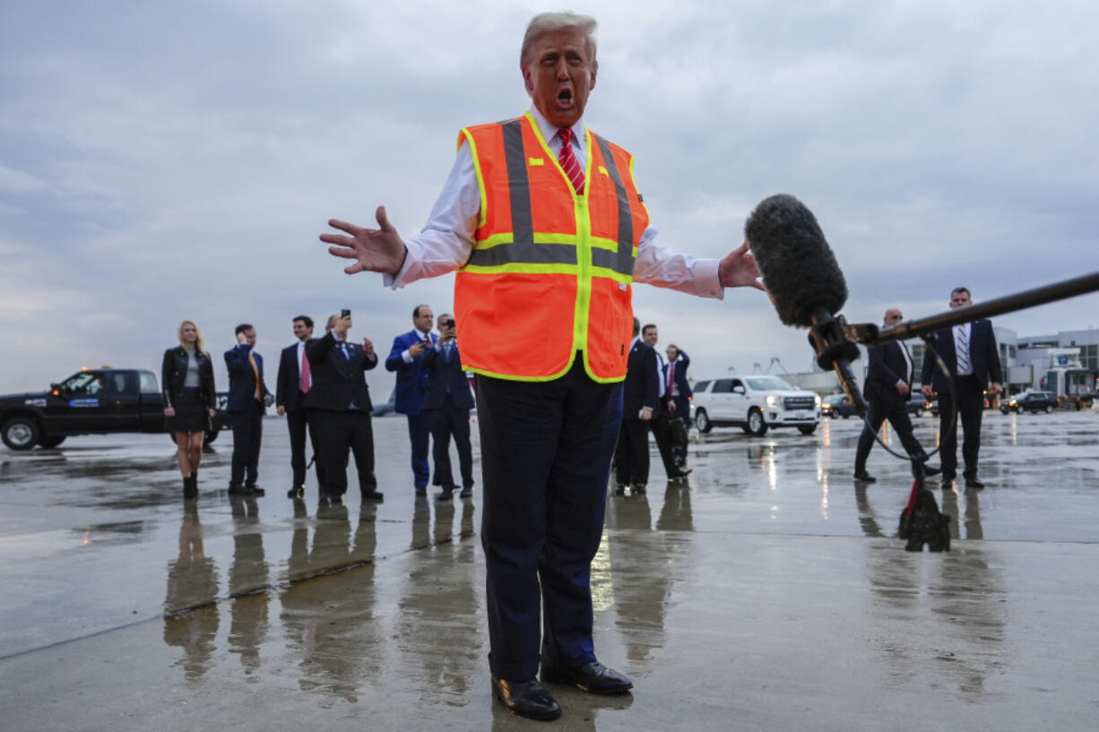 Republican presidential nominee former President Donald Trump talks to reporters at Green Bay Austin Straubel International Airport, Wednesday, Oct. 30, 2024, in Green Bay, Wis.