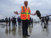 Republican presidential nominee former President Donald Trump talks to reporters at Green Bay Austin Straubel International Airport, Wednesday, Oct. 30, 2024, in Green Bay, Wis.