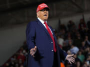 Republican presidential nominee former President Donald Trump arrives to speak during a campaign rally at Dodge County Airport, Sunday, Oct. 6, 2024, in Juneau, Wis.