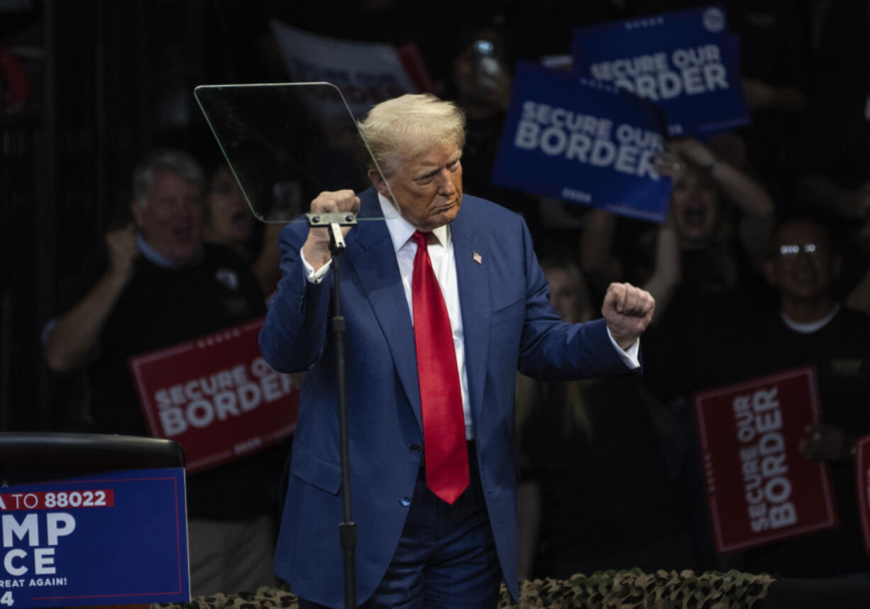 Republican presidential nominee former President Donald Trump dances during a campaign rally at the Findlay Toyota Arena, Sunday, Oct. 13, 2024, in Prescott Valley, Ariz.