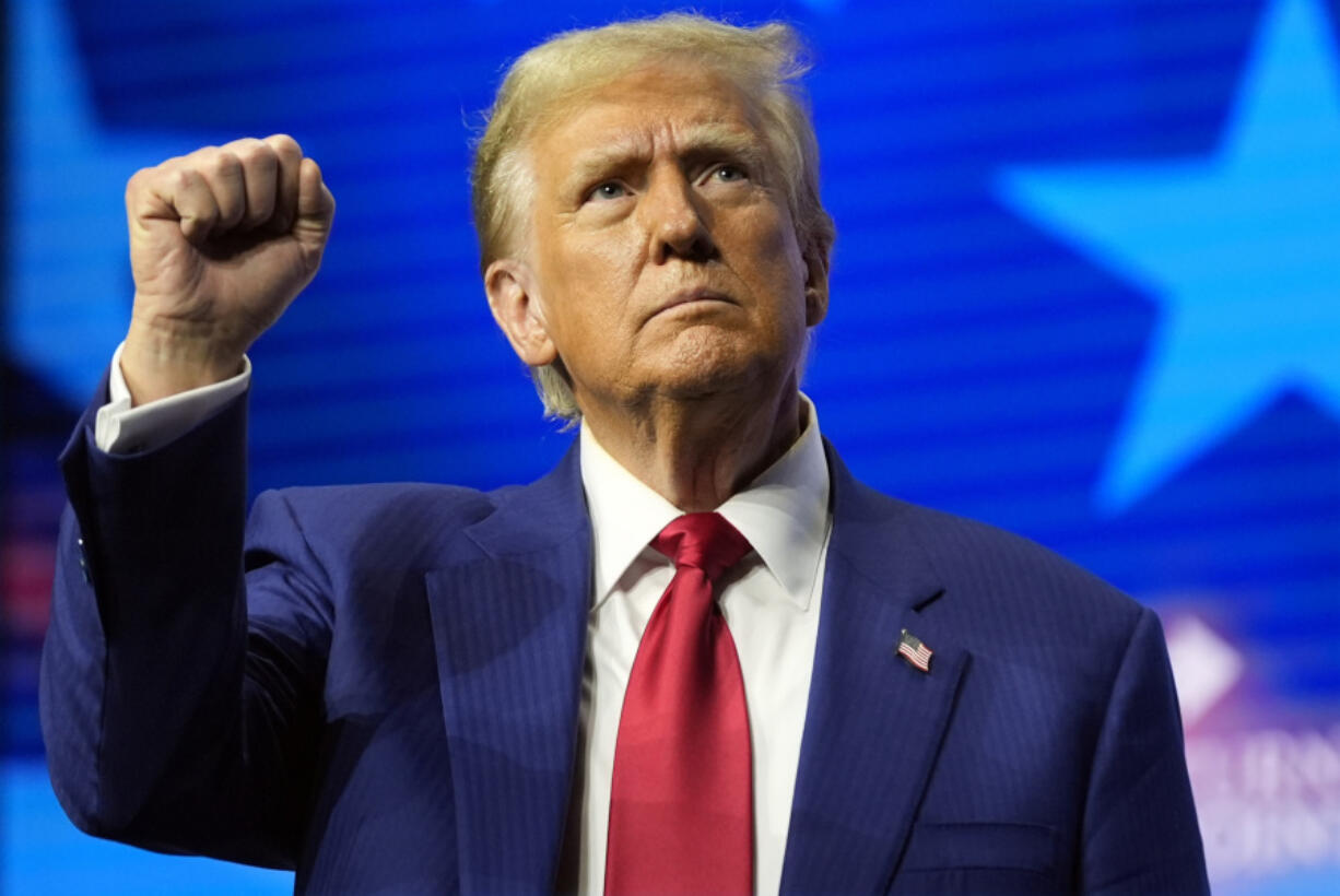 Republican presidential nominee former President Donald Trump gestures at a campaign rally Wednesday, Oct. 23, 2024, in Duluth, Ga.