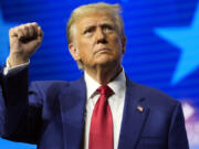 Republican presidential nominee former President Donald Trump gestures at a campaign rally Wednesday, Oct. 23, 2024, in Duluth, Ga.