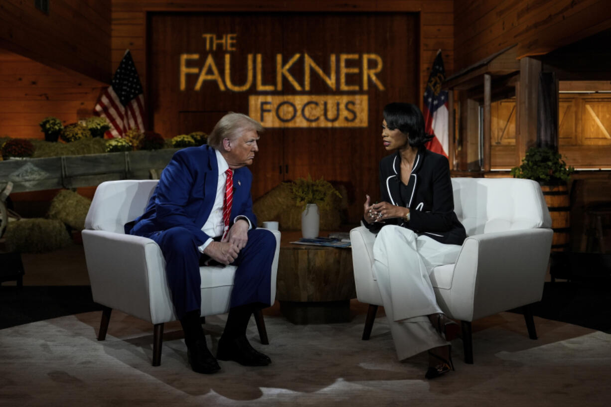 Republican presidential nominee former President Donald Trump speaks during a break in a Fox News town hall with Harris Faulkner at The Reid Barn, Tuesday, Oct. 15, 2024, in Cumming, Ga.