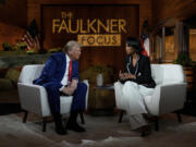 Republican presidential nominee former President Donald Trump speaks during a break in a Fox News town hall with Harris Faulkner at The Reid Barn, Tuesday, Oct. 15, 2024, in Cumming, Ga.