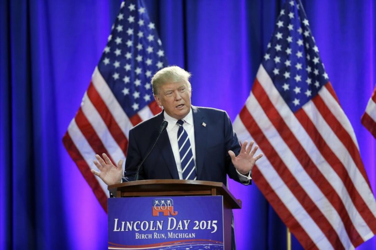 FILE - Republican presidential candidate Donald Trump addresses a GOP fundraising event, Aug 11, 2015, in Birch Run, Mich.