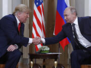 FILE - U.S. President Donald Trump, left, and Russian President Vladimir Putin, right, shake hands at the beginning of a meeting at the Presidential Palace in Helsinki, Finland, July 16, 2018.