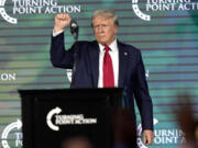 FILE - Republican presidential candidate former President Donald Trump gestures as he finishes speaking at The Believers&rsquo; Summit 2024 at a Turning Point Action event in West Palm Beach, Fla., July 26, 2024.