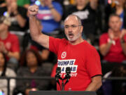 FILE - United Auto Workers President Shawn Fain speaks at a campaign rally for Democratic presidential nominee Vice President Kamala Harris at the Dort Financial Center in Flint, Mich., Oct. 4, 2024.