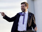 Republican vice presidential nominee Sen. JD Vance, R-Ohio, greets the crowd as he arrives to speak at a campaign rally at Wilmington International Airport, Wednesday, Oct. 16, 2024, in Wilmington, N.C.