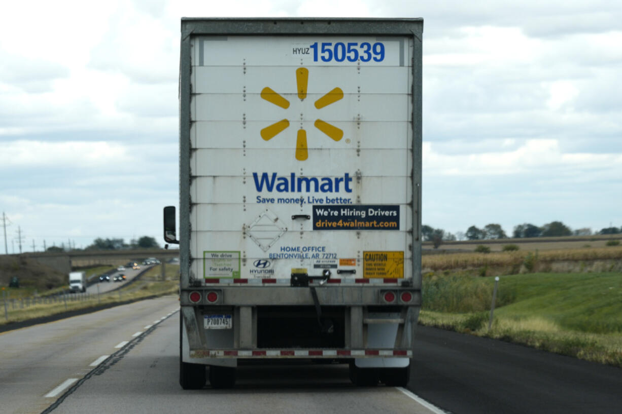 The Walmart truck fleet has We&rsquo;re Hiring Drivers signage on the back of the truck on I-88 road in Franklin Grove, Ill., Monday, Oct. 14, 2024. (AP Photo/Nam Y.