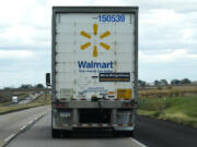 The Walmart truck fleet has We&rsquo;re Hiring Drivers signage on the back of the truck on I-88 road in Franklin Grove, Ill., Monday, Oct. 14, 2024. (AP Photo/Nam Y.