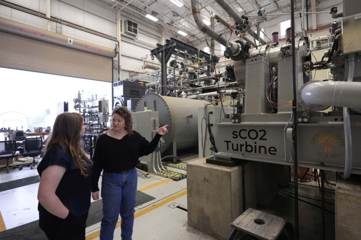 Cindy Taff, right, and Brianna Byrd, with Sage Geosystems, a startup that aims to make clean electricity, visit Southwest Research Institute on April 1 where testing and research is taking place in San Antonio.