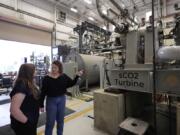 Cindy Taff, right, and Brianna Byrd, with Sage Geosystems, a startup that aims to make clean electricity, visit Southwest Research Institute on April 1 where testing and research is taking place in San Antonio.