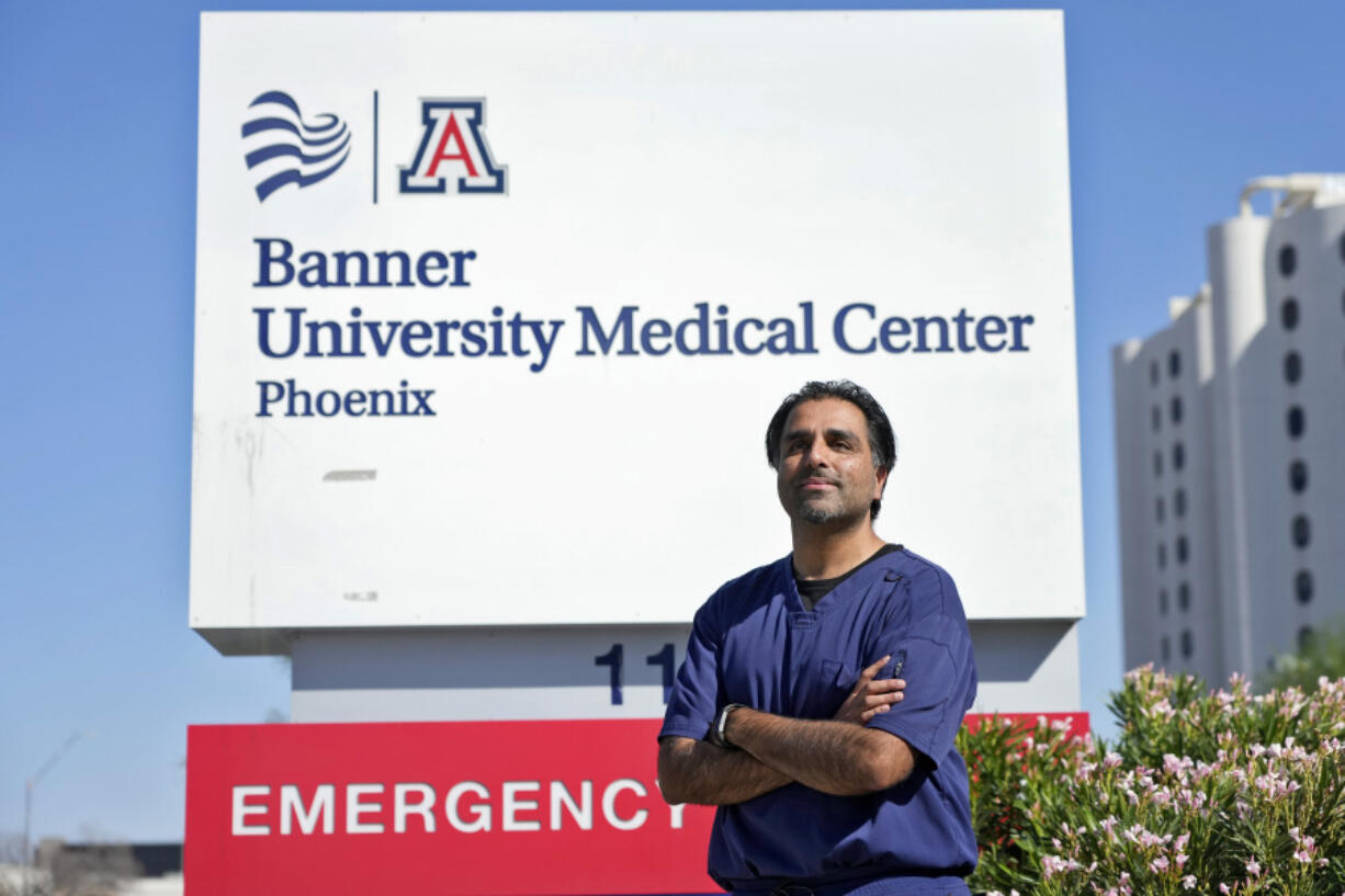 Dr. Aneesh Naran stands outside the Banner University Medical Center emergency room after his shift, Monday, Oct. 7, 2024 in Phoenix.