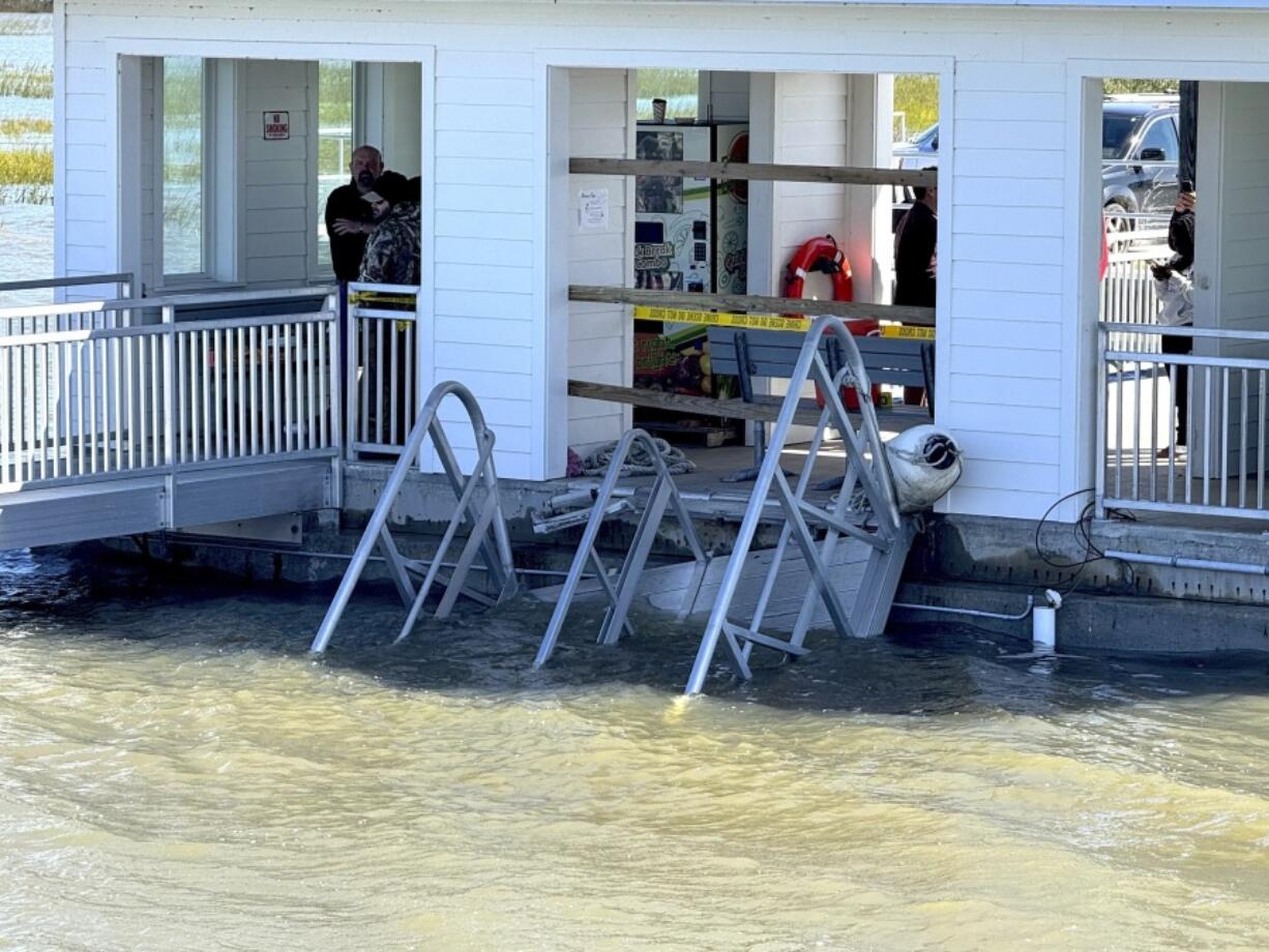 A portion of the gangway which collapsed Saturday afternoon remains visible on Sapelo Island in McIntosh county, Ga., Sunday, Oct. 20, 2024.