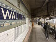 Passengers leave a train at the Wall St. subway station in New York&rsquo;s Financial District on Wednesday, Oct. 9, 2024.