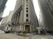 FILE - The entrance to the New York Stock Exchange at Wall and New Streets is shown on Oct. 2, 2024, in New York.