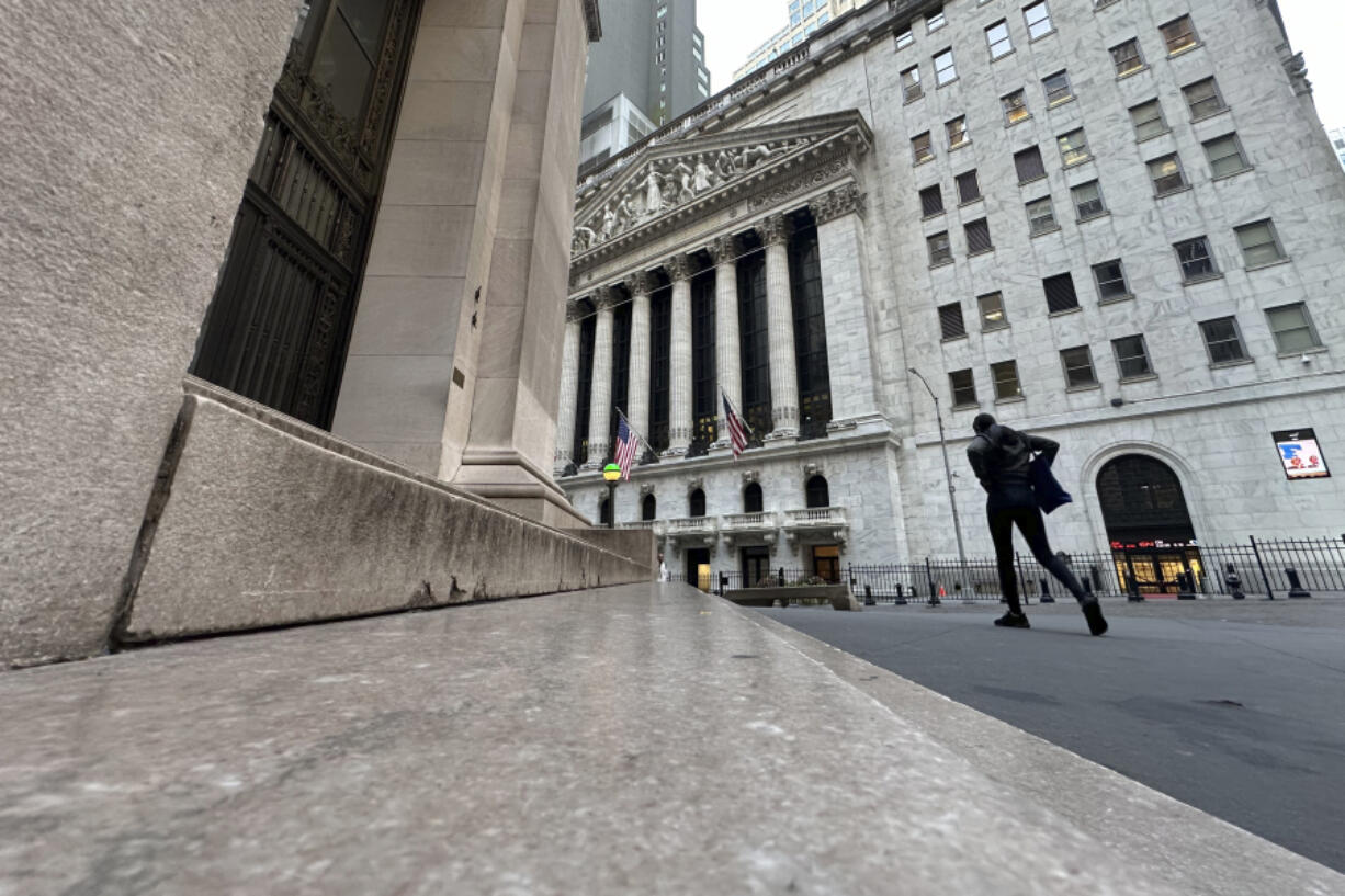 The New York Stock Exchange, rear, is shown on Tuesday, Oct. 8, 2024, in New York.